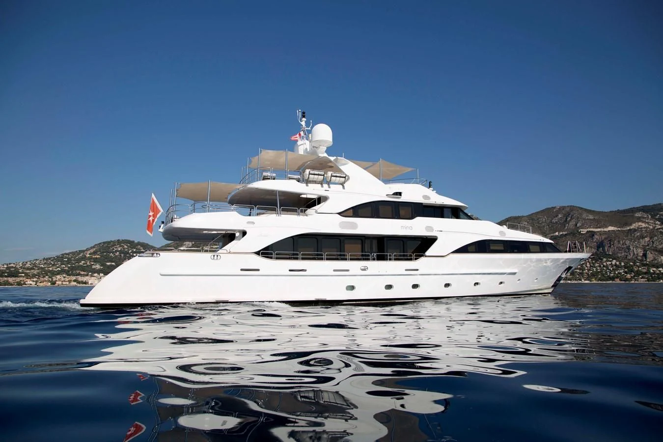 a white yacht on the water aboard MINA Yacht for Sale