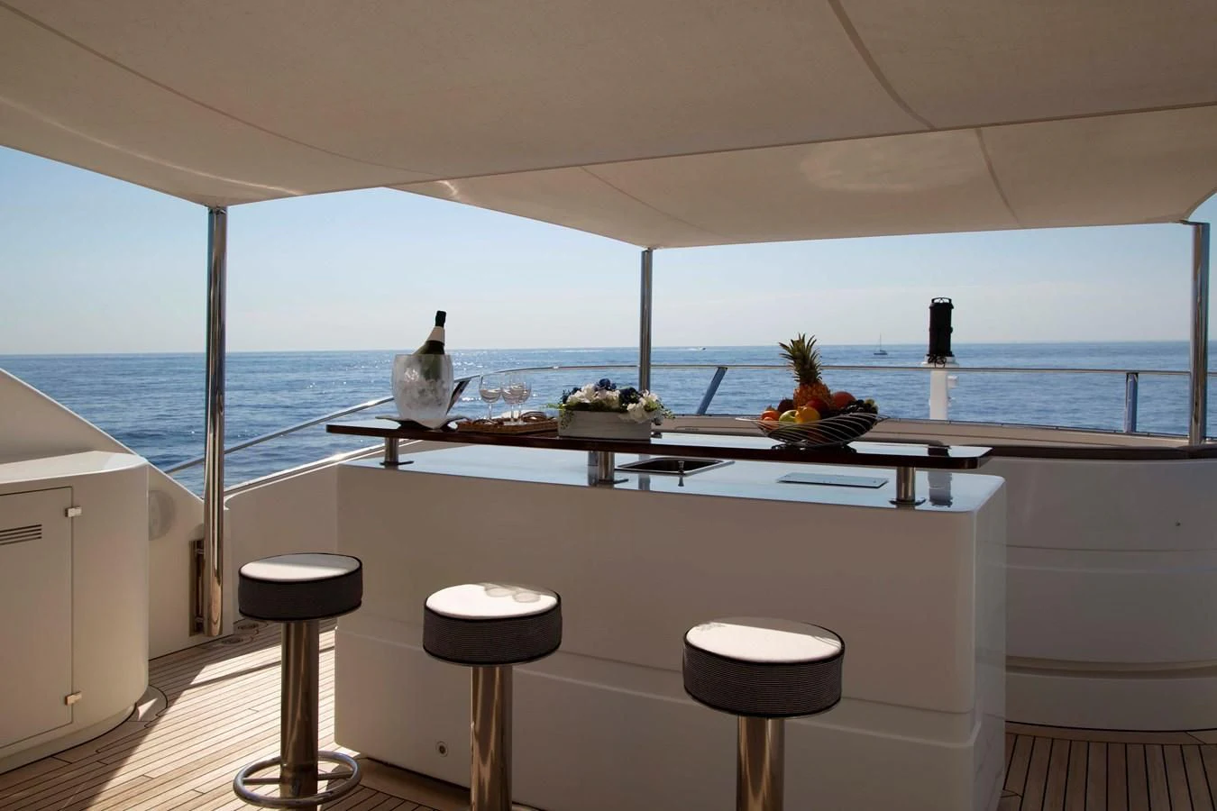 a large white room with a large window overlooking the ocean aboard MINA Yacht for Sale