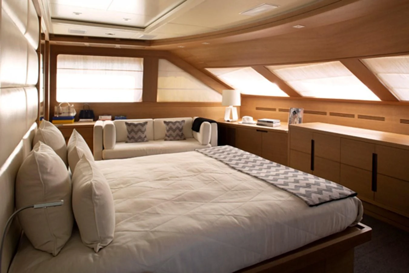 a room with a bed and a window aboard MINA Yacht for Sale