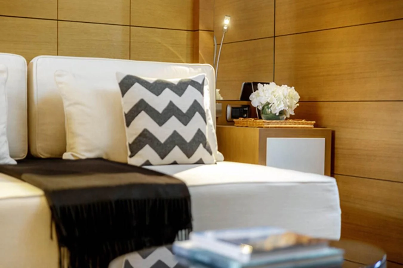 a room with a bed and a mirror aboard MINA Yacht for Sale