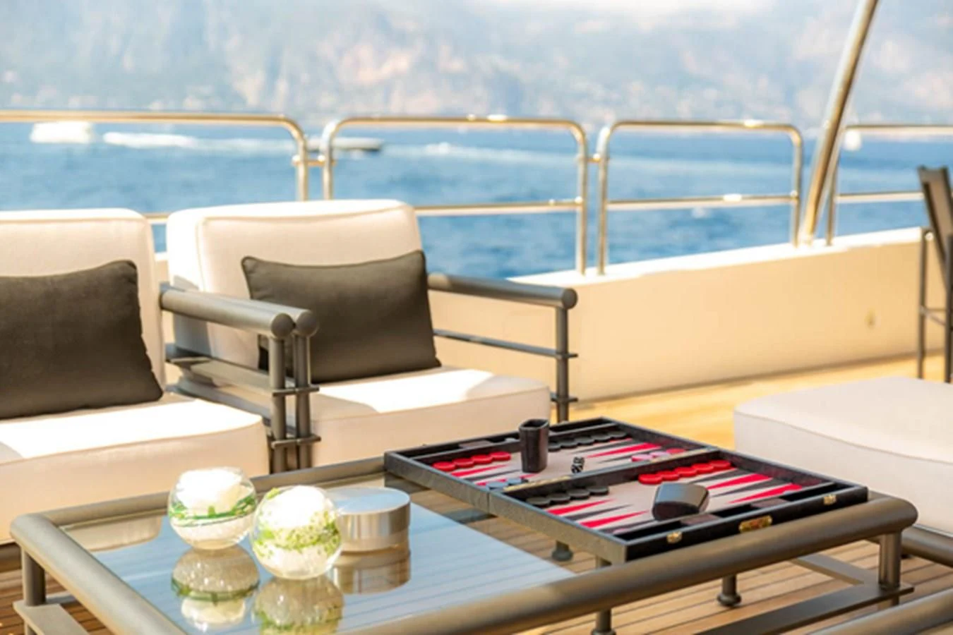 a table with chairs and a table on it aboard MINA Yacht for Sale