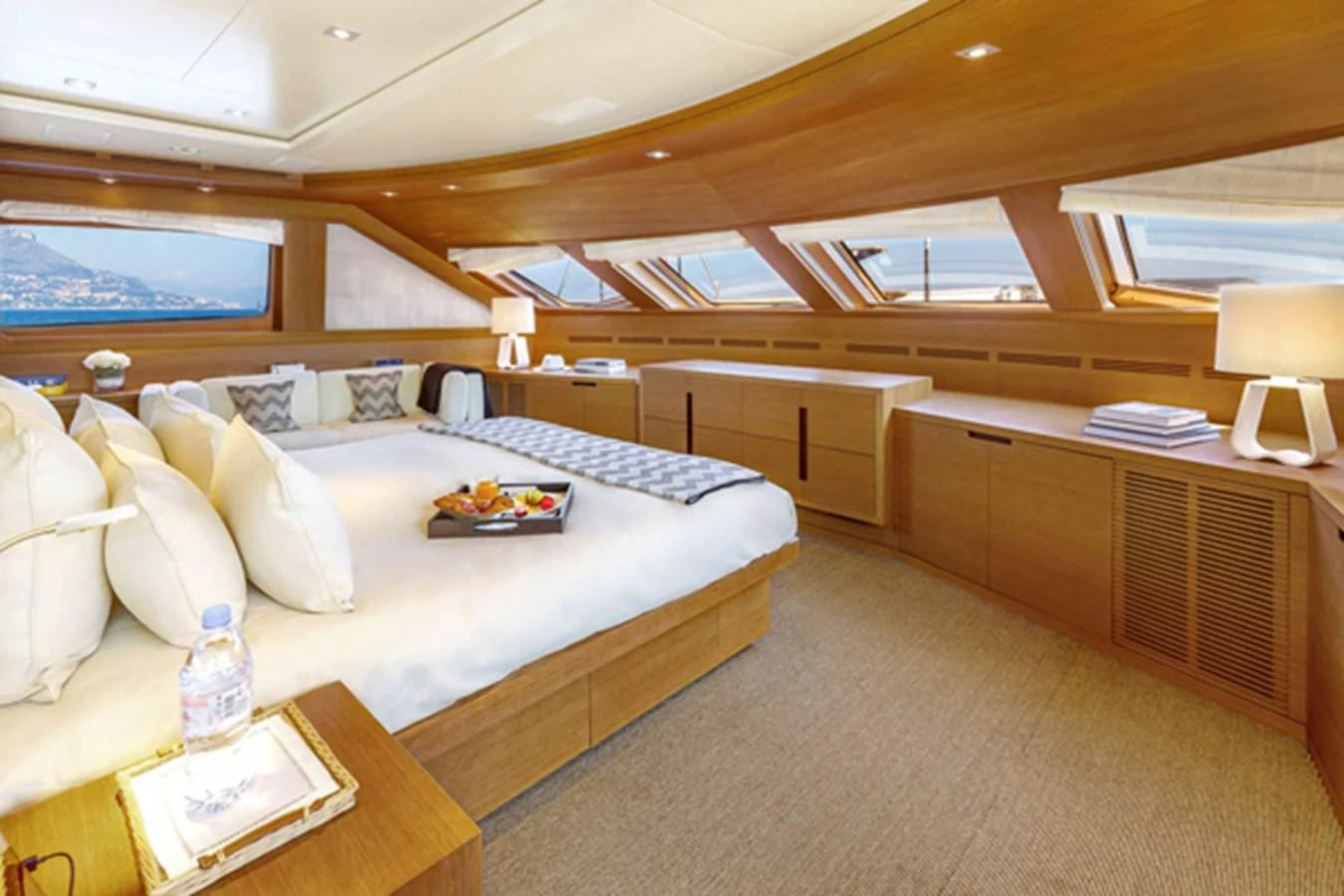 a room with a bed and a table aboard MINA Yacht for Sale