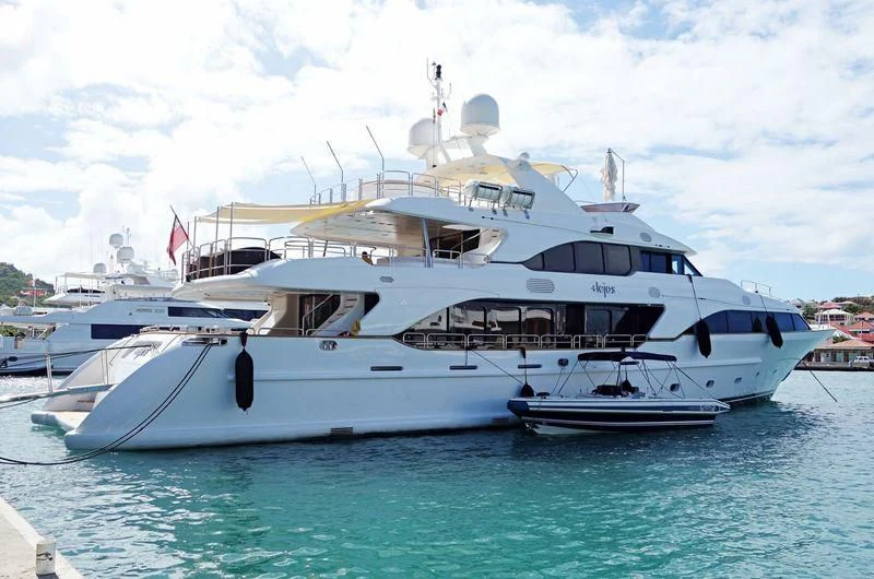 a large white boat in the water aboard MINA Yacht for Sale