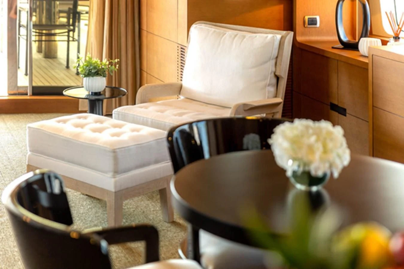 a white flower on a table aboard MINA Yacht for Sale