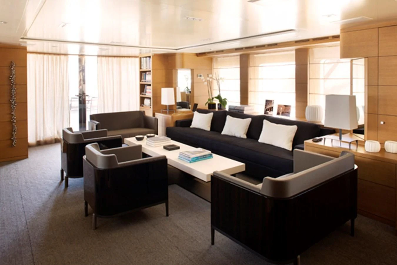 a living room with a couch and a coffee table aboard MINA Yacht for Sale