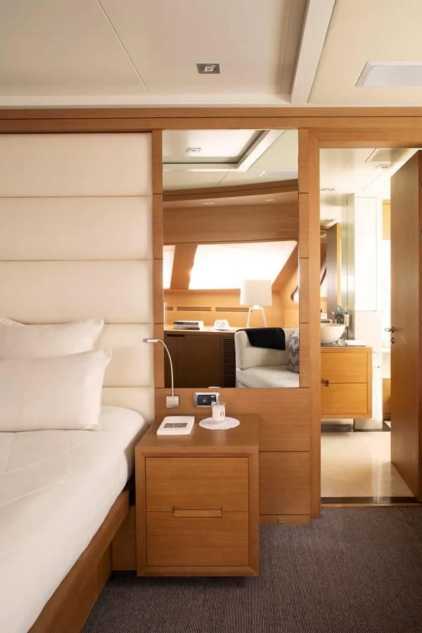 a room with a bed and a desk aboard MINA Yacht for Sale