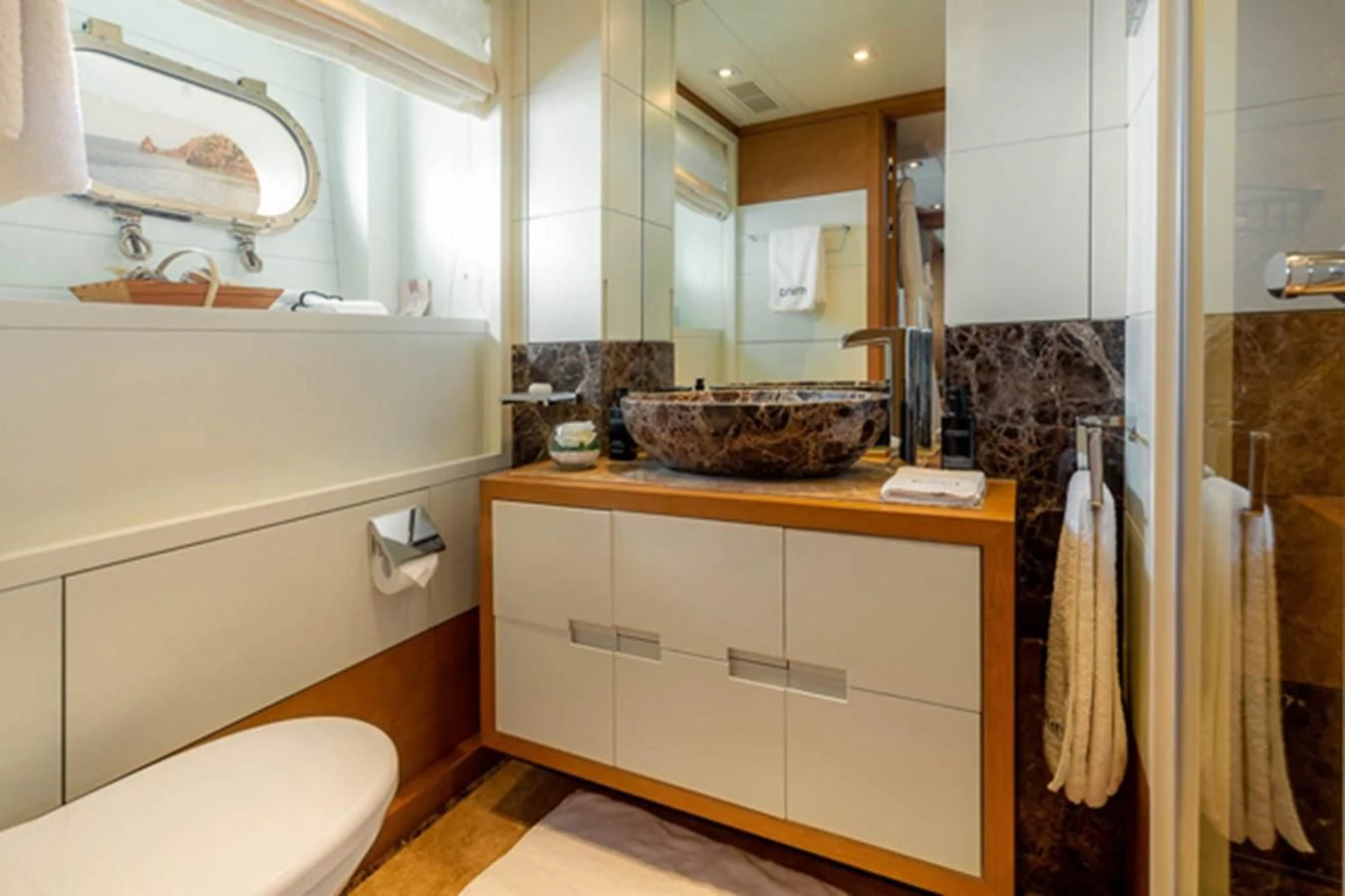 a bathroom with a sink and a mirror aboard MINA Yacht for Sale