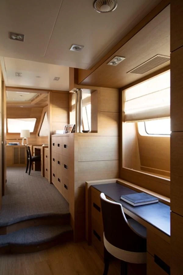 a room with a desk and a window aboard MINA Yacht for Sale