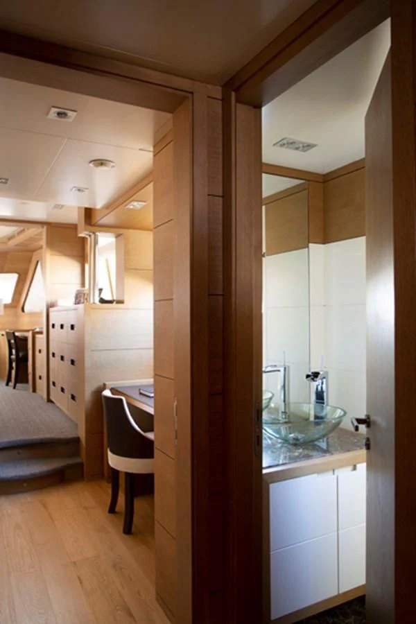a bathroom with a glass shower aboard MINA Yacht for Sale