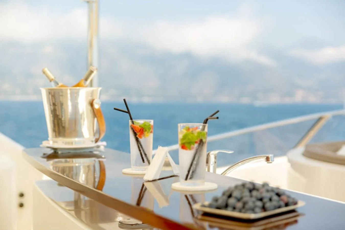 a table with a tray of food and drinks on it aboard MINA Yacht for Sale