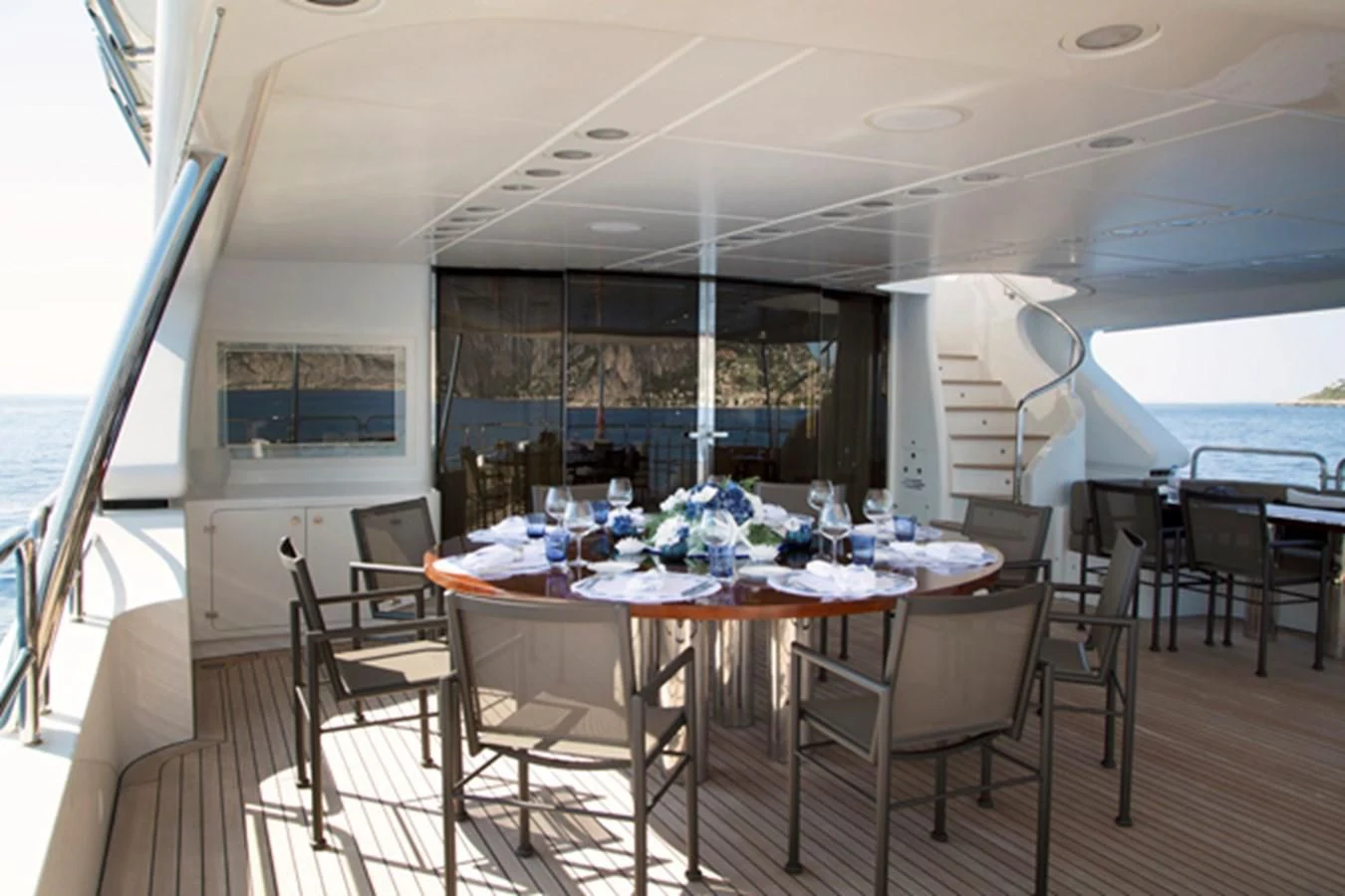 a table with chairs around it aboard MINA Yacht for Sale