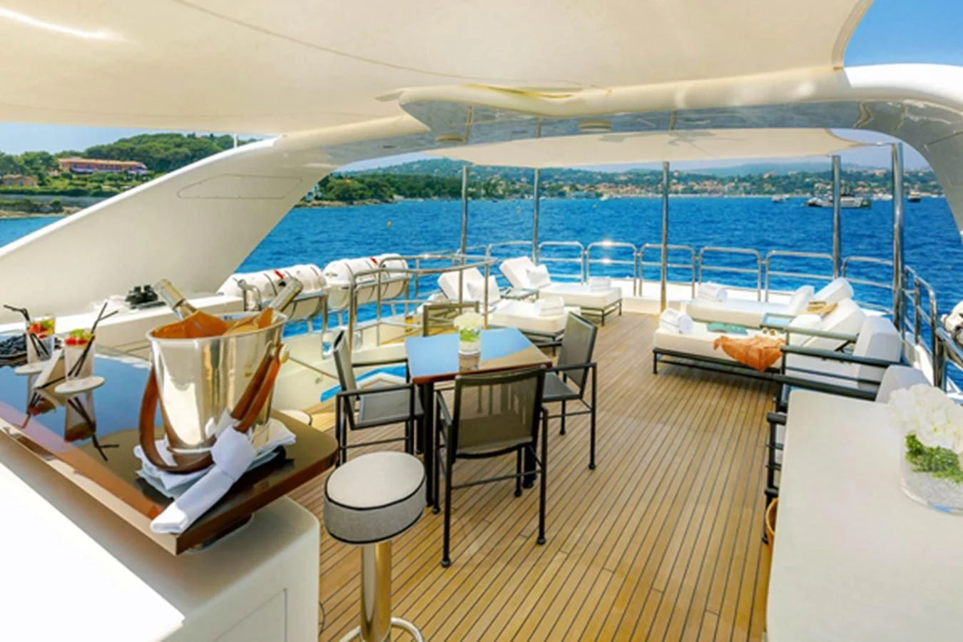 a room with tables and chairs aboard MINA Yacht for Sale