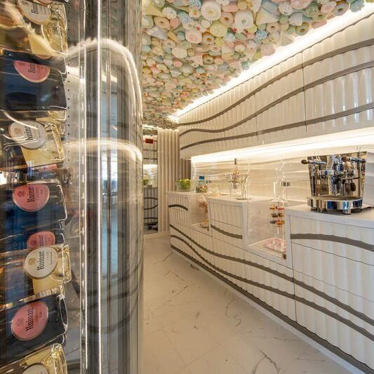 a large room with a large display of items on the wall aboard OCEANBIRD Yacht for Sale