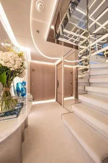 a white staircase with white walls aboard OCEANBIRD Yacht for Sale