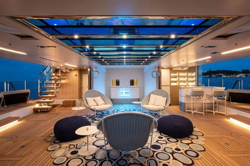 a room with chairs and tables aboard OCEANBIRD Yacht for Sale