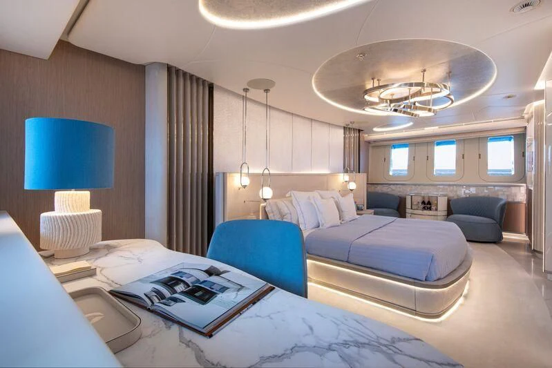 a room with a bed and a desk aboard OCEANBIRD Yacht for Sale