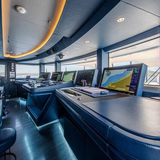 a room with computers and monitors aboard OCEANBIRD Yacht for Sale