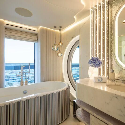 a bathroom with a tub and a sink aboard OCEANBIRD Yacht for Sale