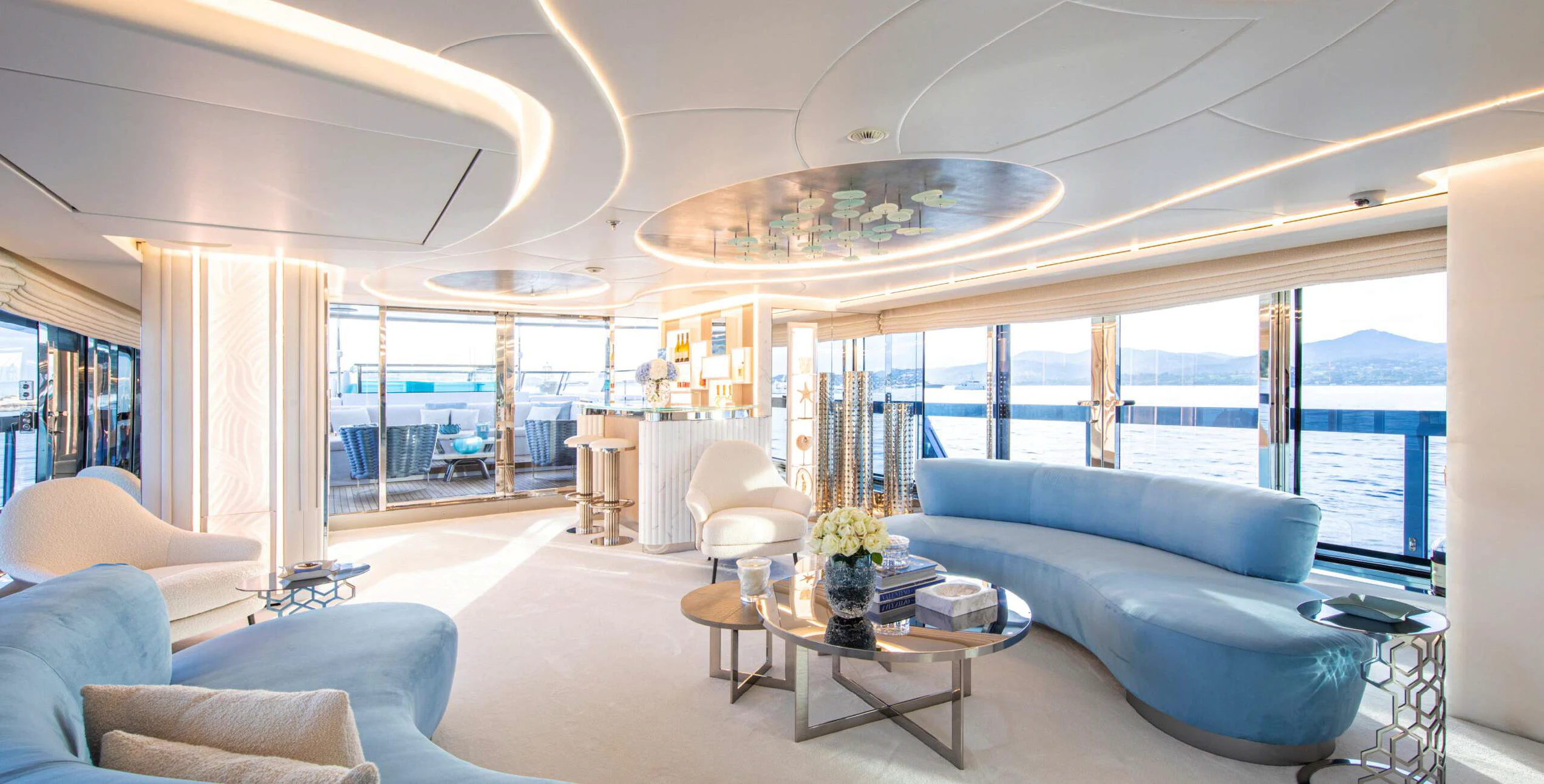 a living room with a large window aboard OCEANBIRD Yacht for Sale