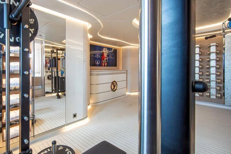 a hallway with blue walls aboard OCEANBIRD Yacht for Sale