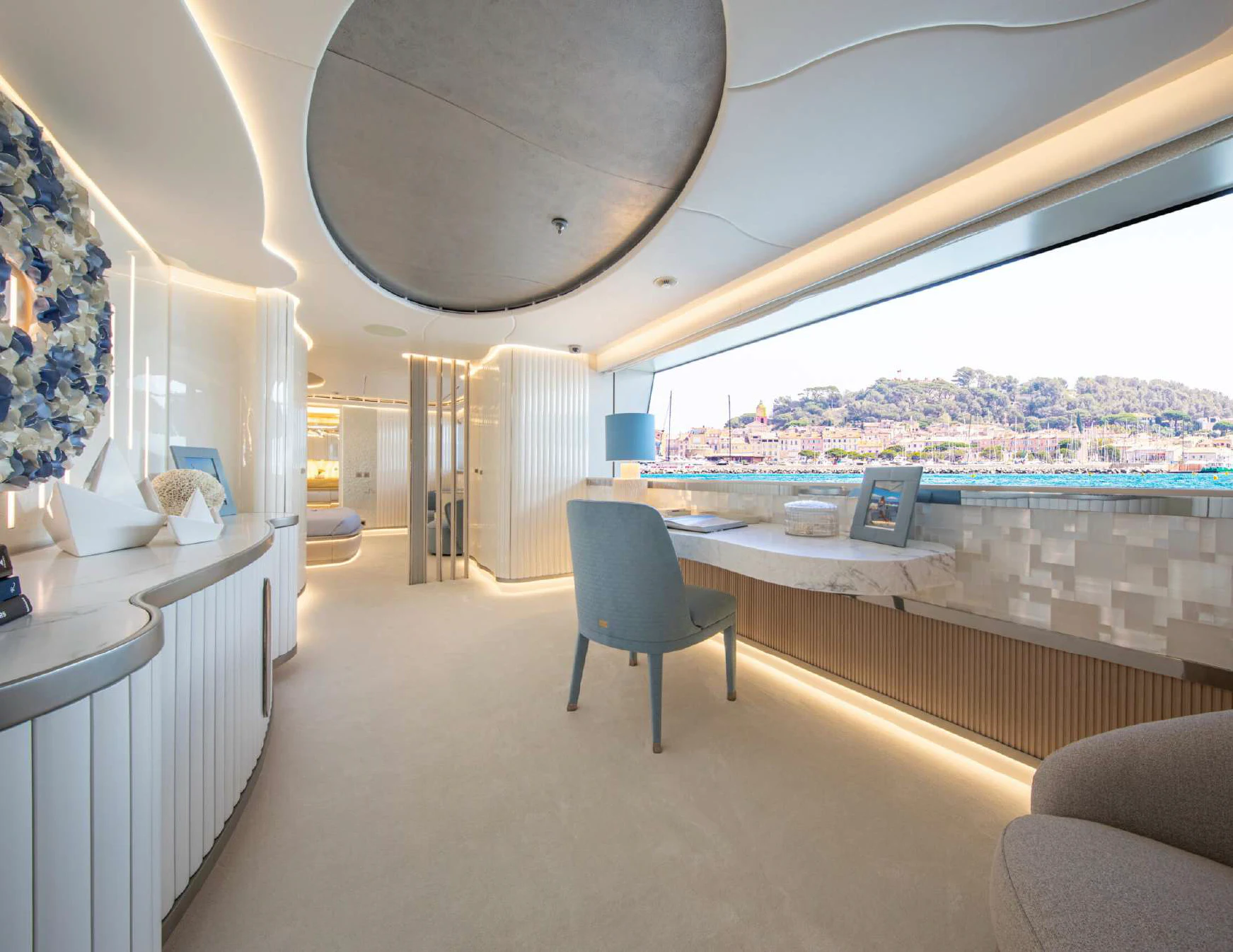 a room with a chair and a table and a window aboard OCEANBIRD Yacht for Sale
