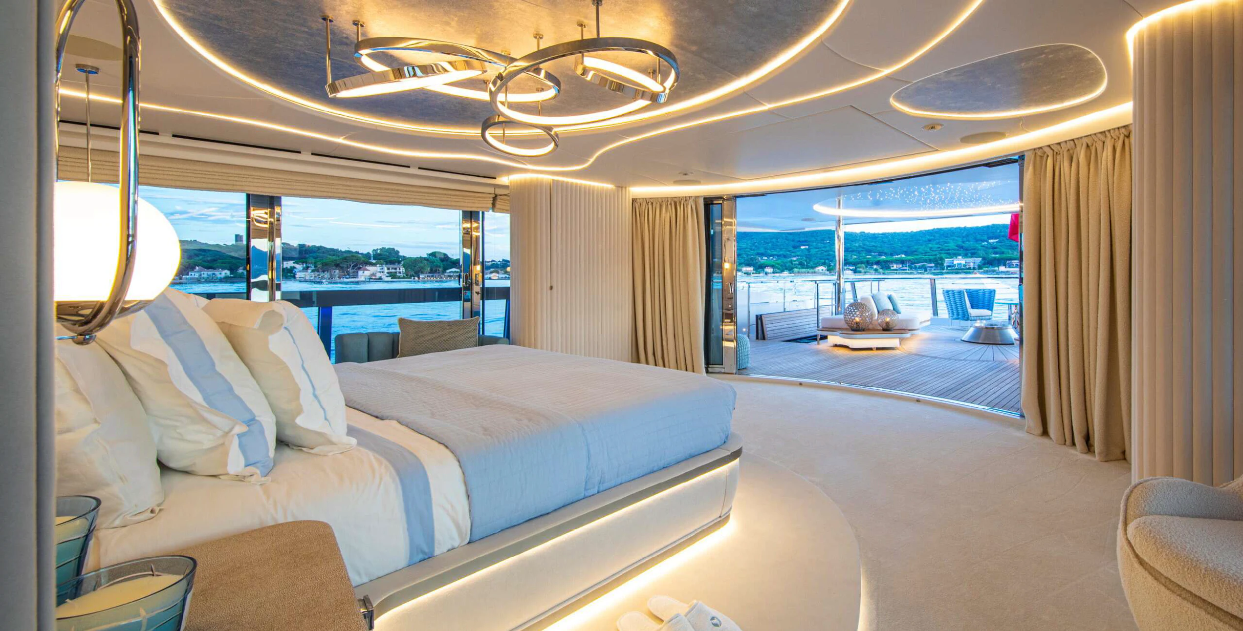 a room with a bed and a view of the water aboard OCEANBIRD Yacht for Sale