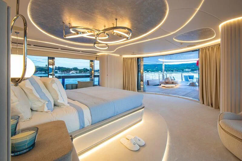 a room with a bed and a view of the water aboard OCEANBIRD Yacht for Sale