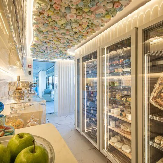 a kitchen with a glass door aboard OCEANBIRD Yacht for Sale