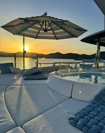 a pool with a large umbrella aboard OCEANBIRD Yacht for Sale