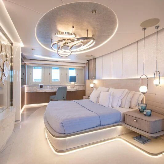 a bedroom with a chandelier aboard OCEANBIRD Yacht for Sale