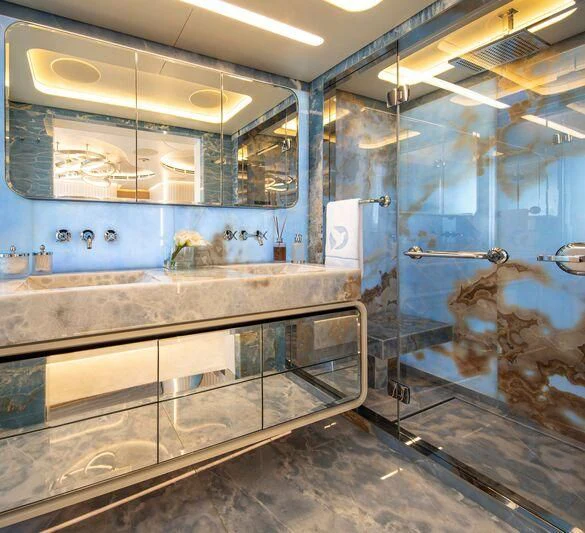 a large kitchen with glass walls aboard OCEANBIRD Yacht for Sale