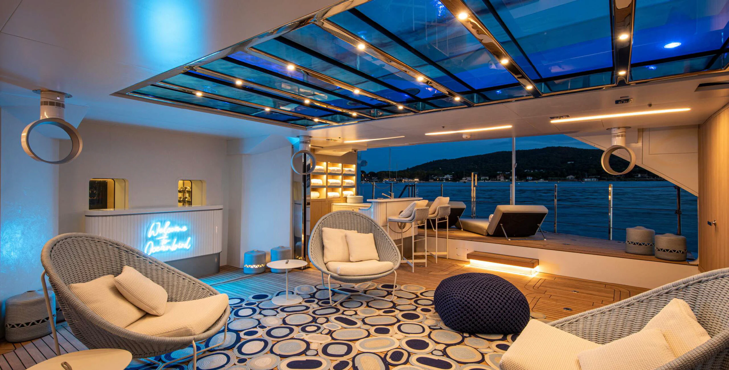 a large room with chairs and a tv aboard OCEANBIRD Yacht for Sale