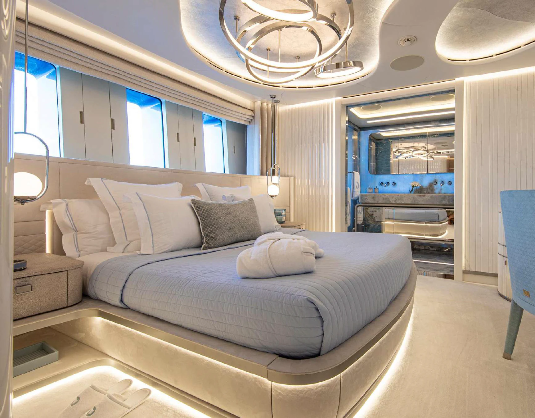 a bedroom with a bed and a large mirror aboard OCEANBIRD Yacht for Sale