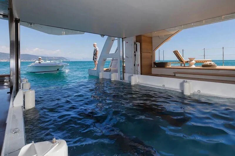 a person standing on a boat in the water aboard OCEANBIRD Yacht for Sale