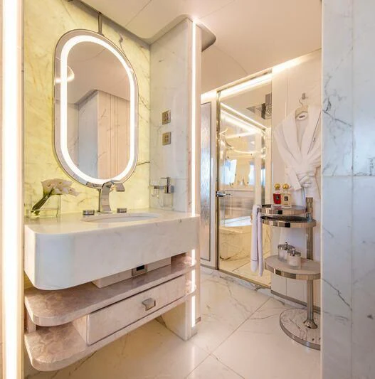 a bathroom with a sink and mirror aboard OCEANBIRD Yacht for Sale