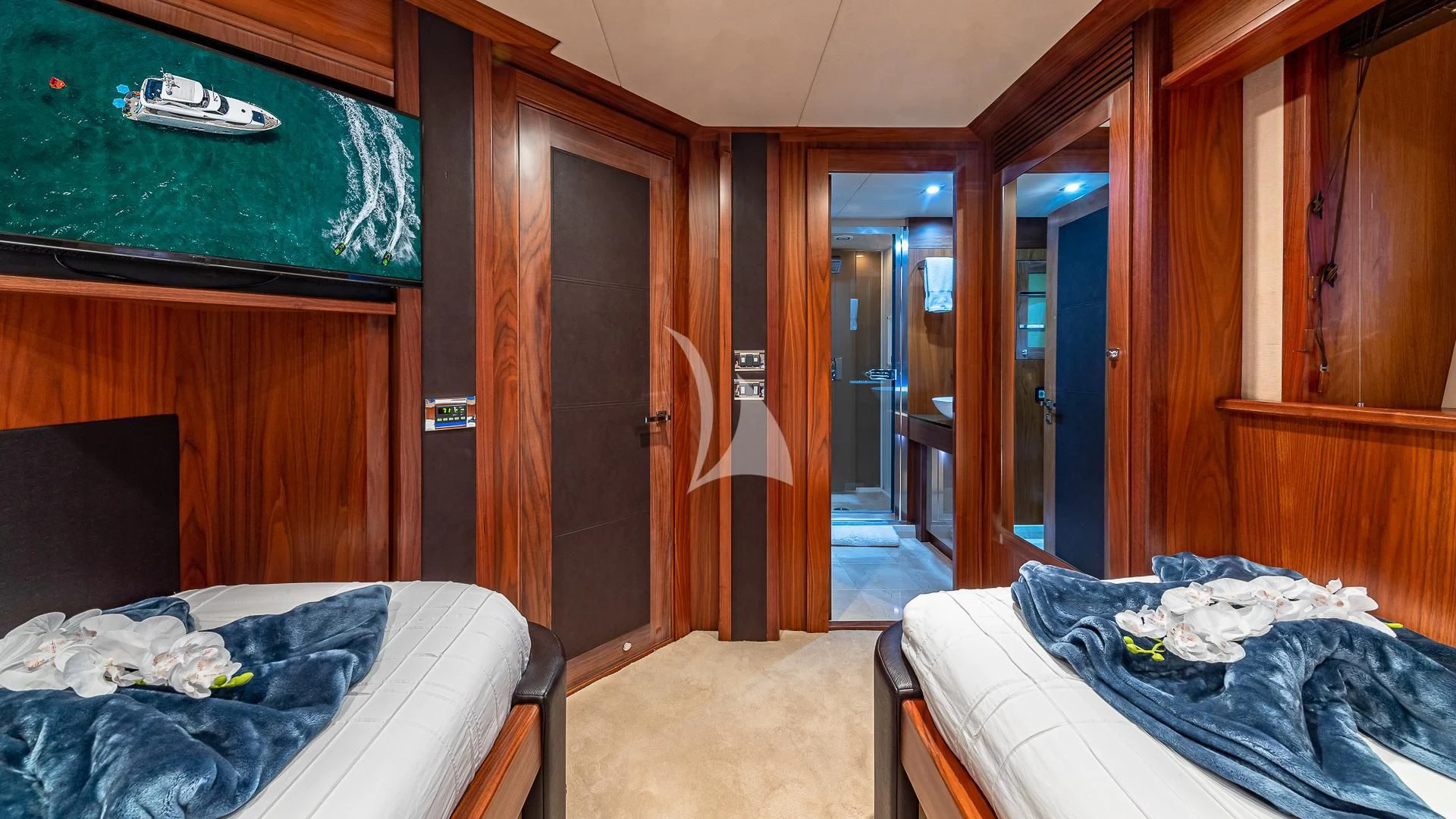 a room with a bed and a door aboard EMRYS Yacht for Sale