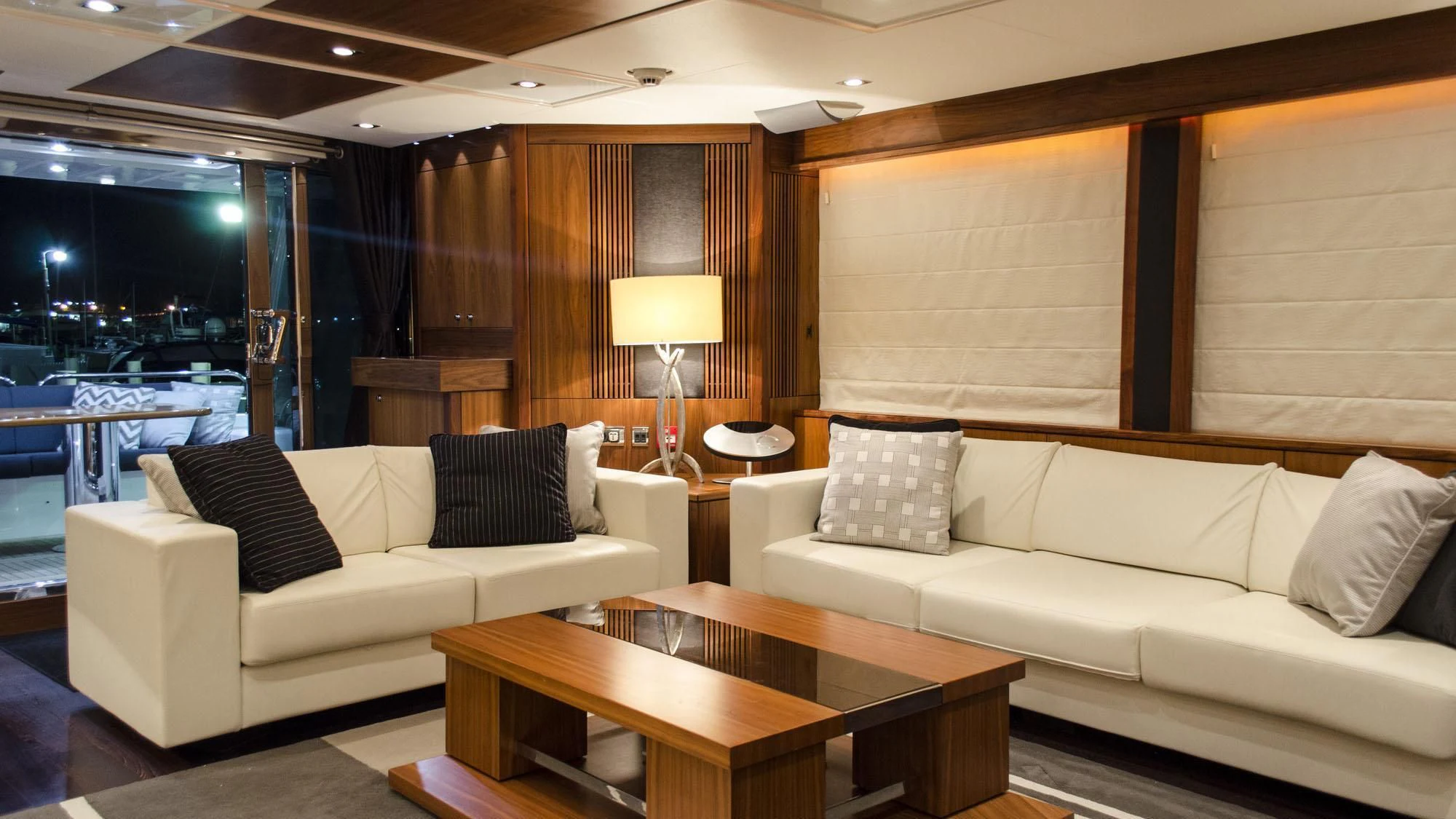 a living room with a couch and a table aboard EMRYS Yacht for Sale