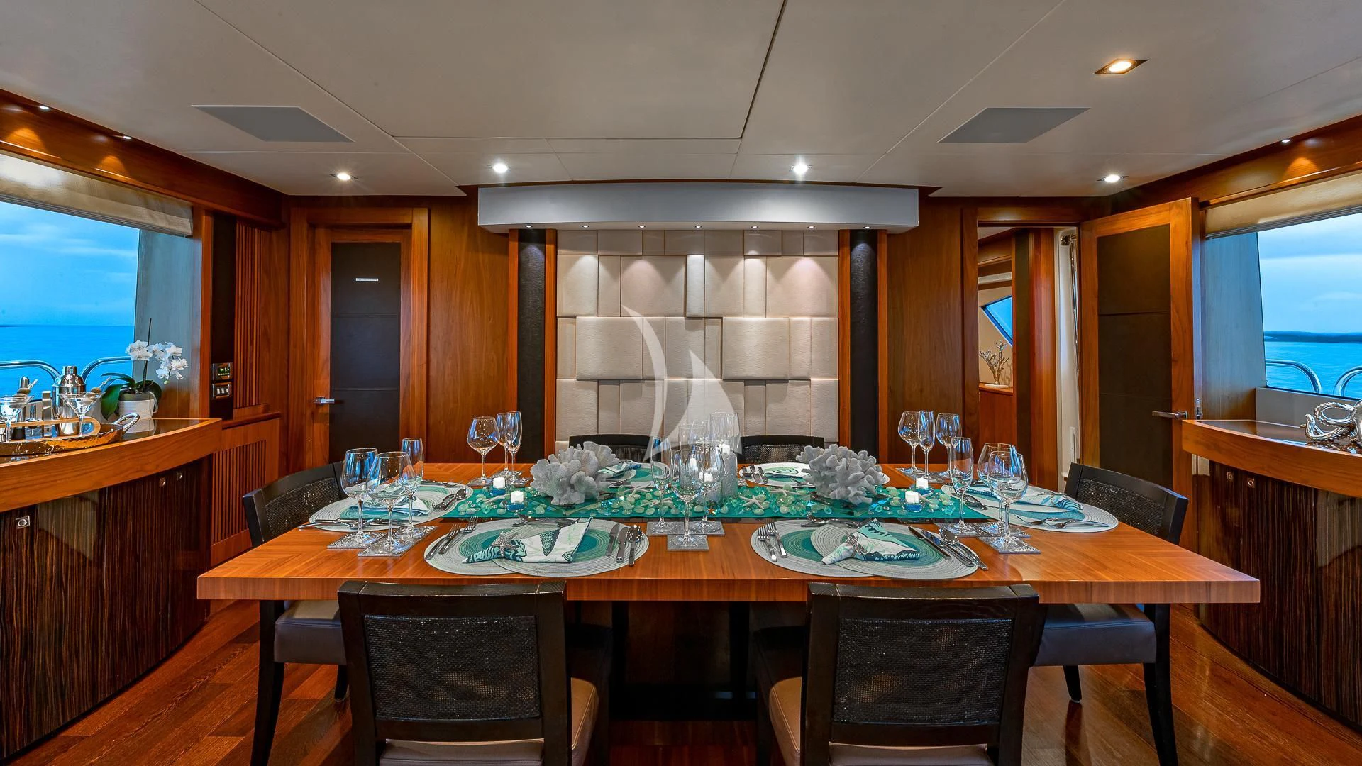 a dining table with a fireplace aboard EMRYS Yacht for Sale