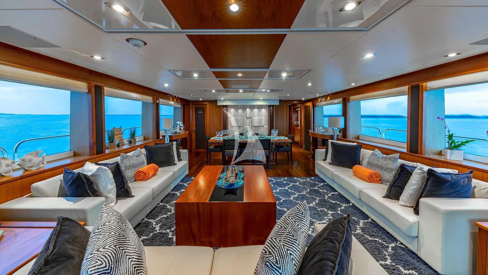 a living room with a large window aboard EMRYS Yacht for Sale