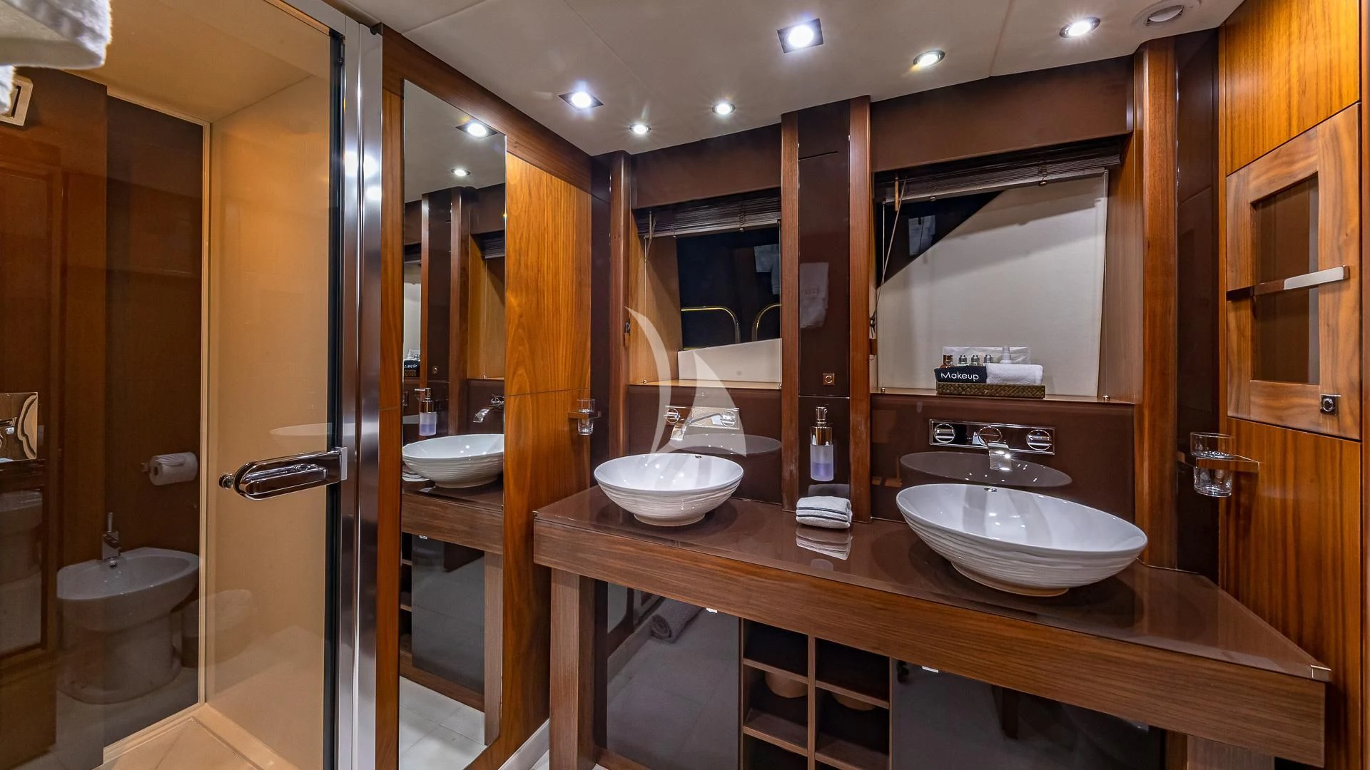 a bathroom with a sink and a mirror aboard EMRYS Yacht for Sale