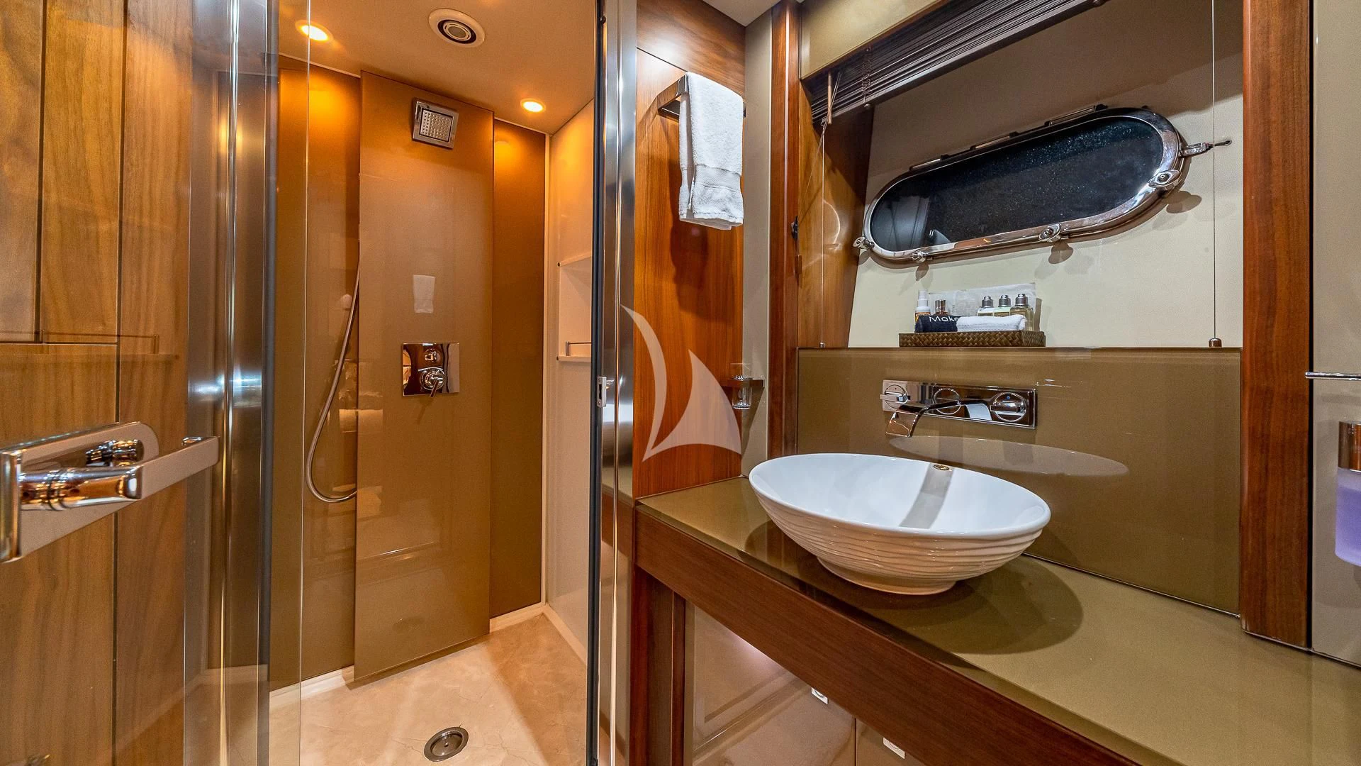 a bathroom with a sink and a mirror aboard EMRYS Yacht for Sale