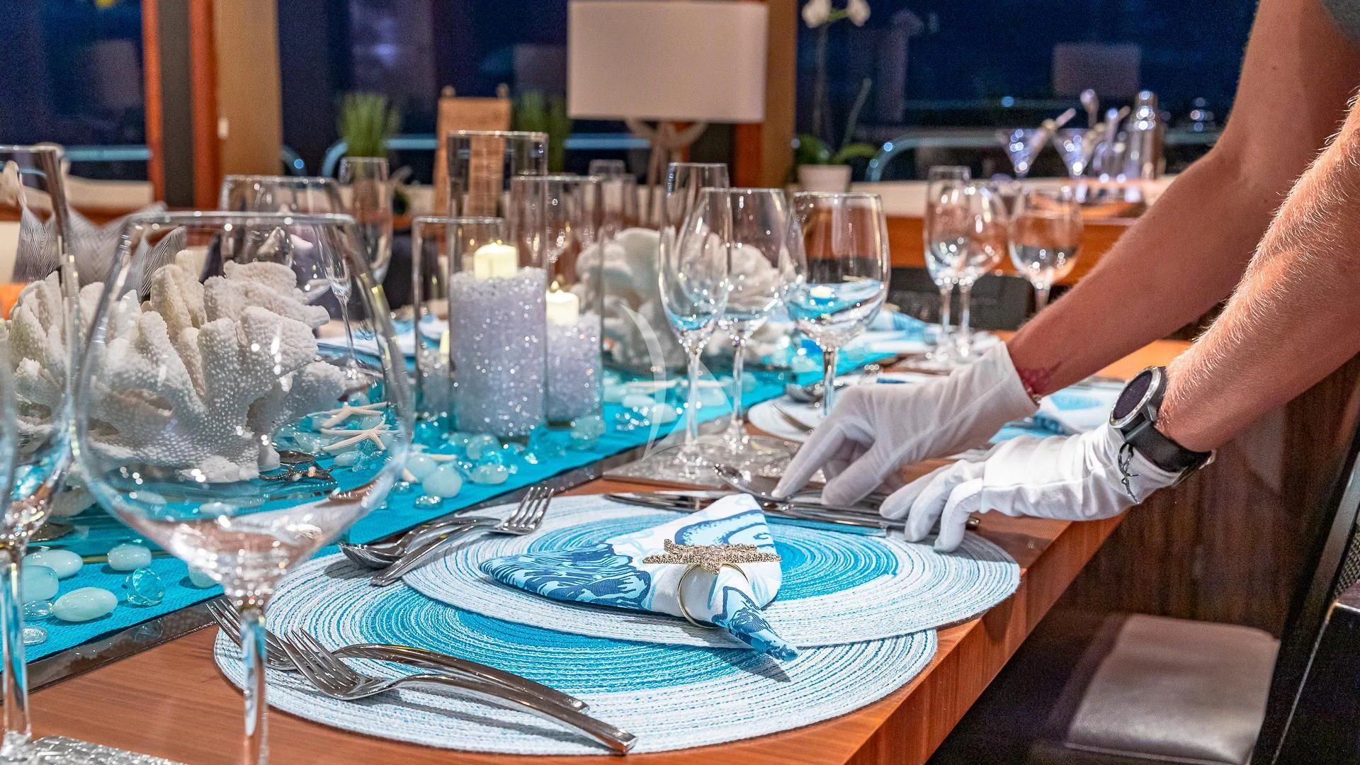 a person cutting a cake aboard EMRYS Yacht for Sale