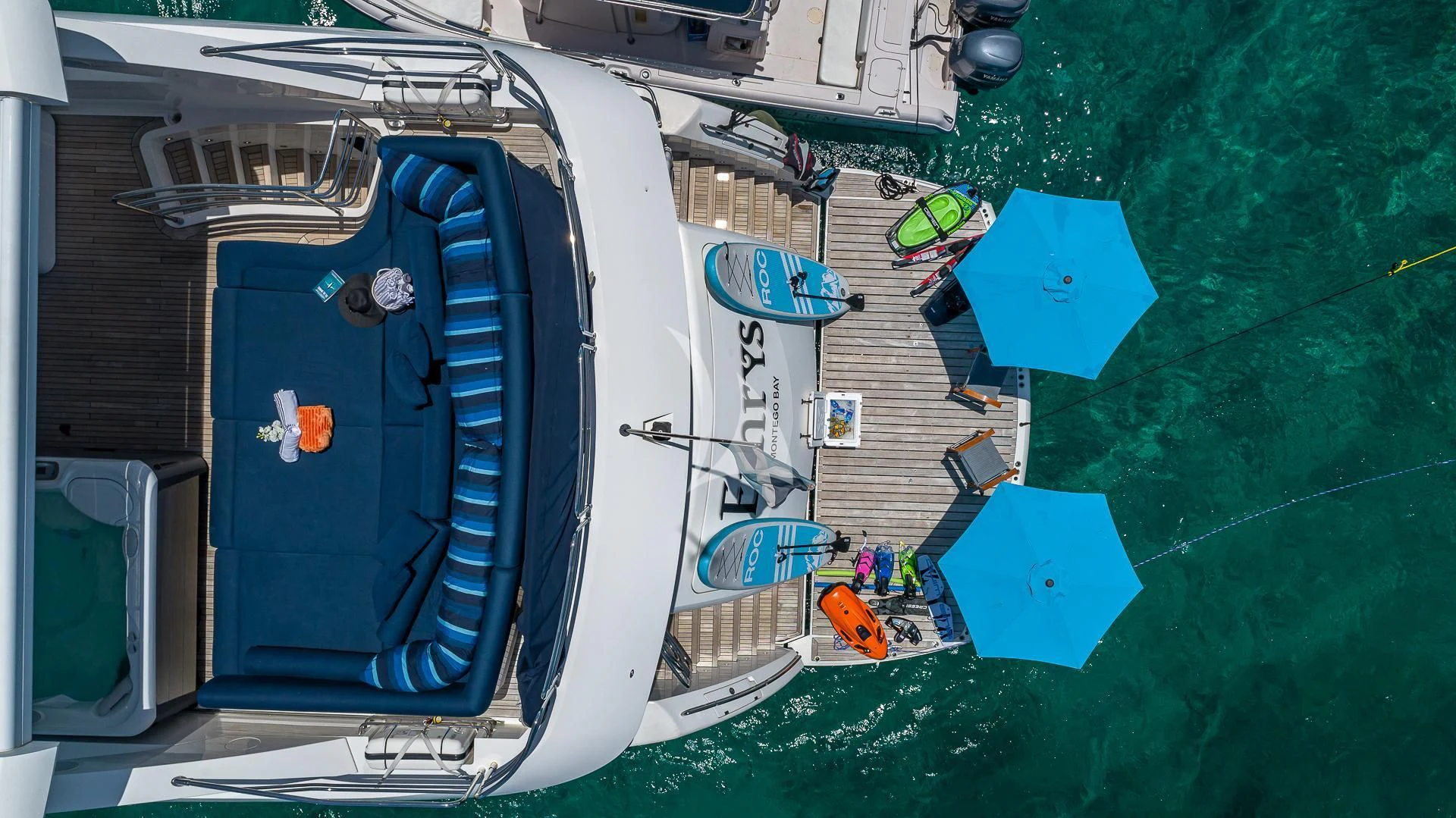 a boat with a blue cover aboard EMRYS Yacht for Sale