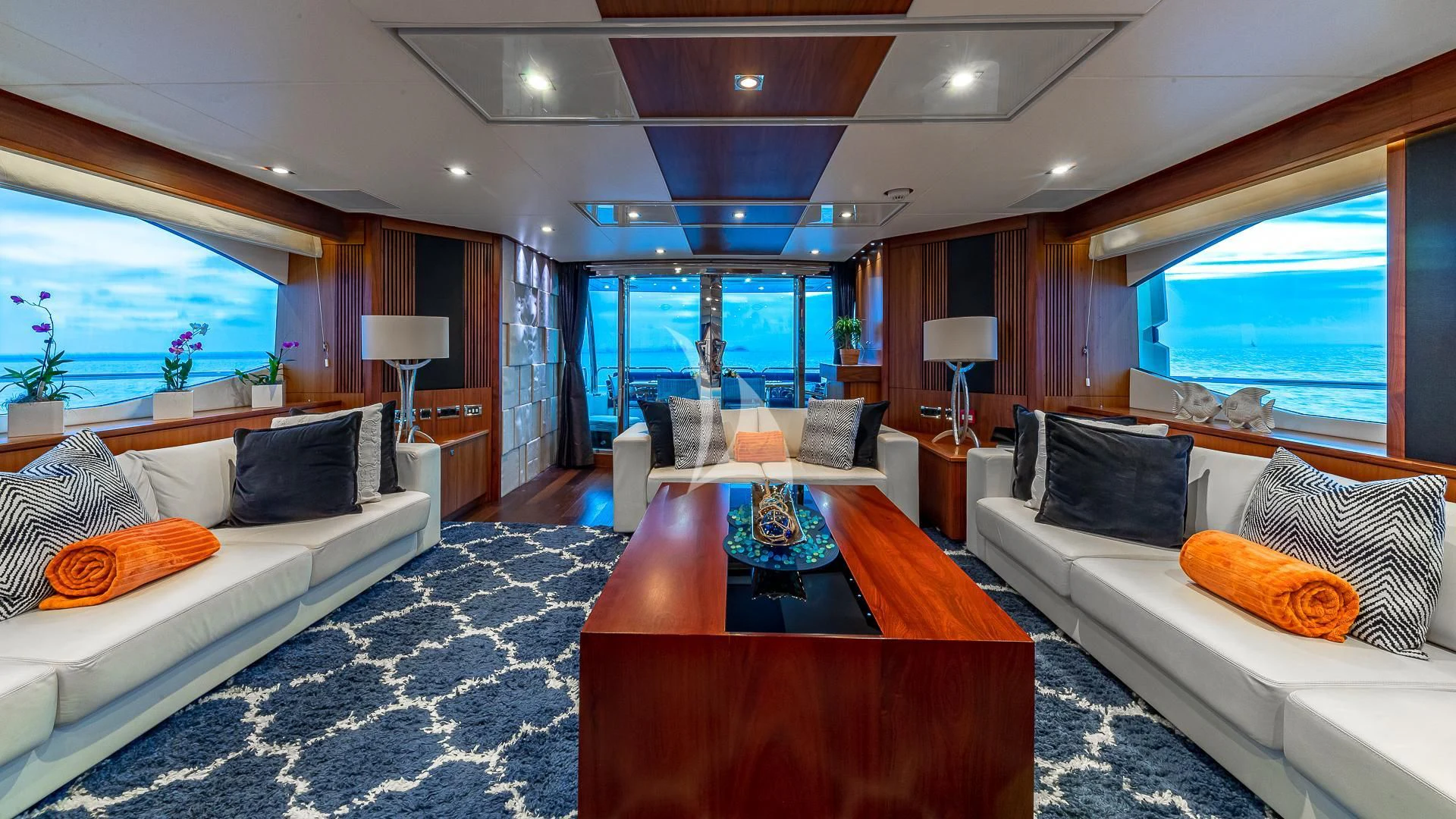 a room with a bed and a table aboard EMRYS Yacht for Sale