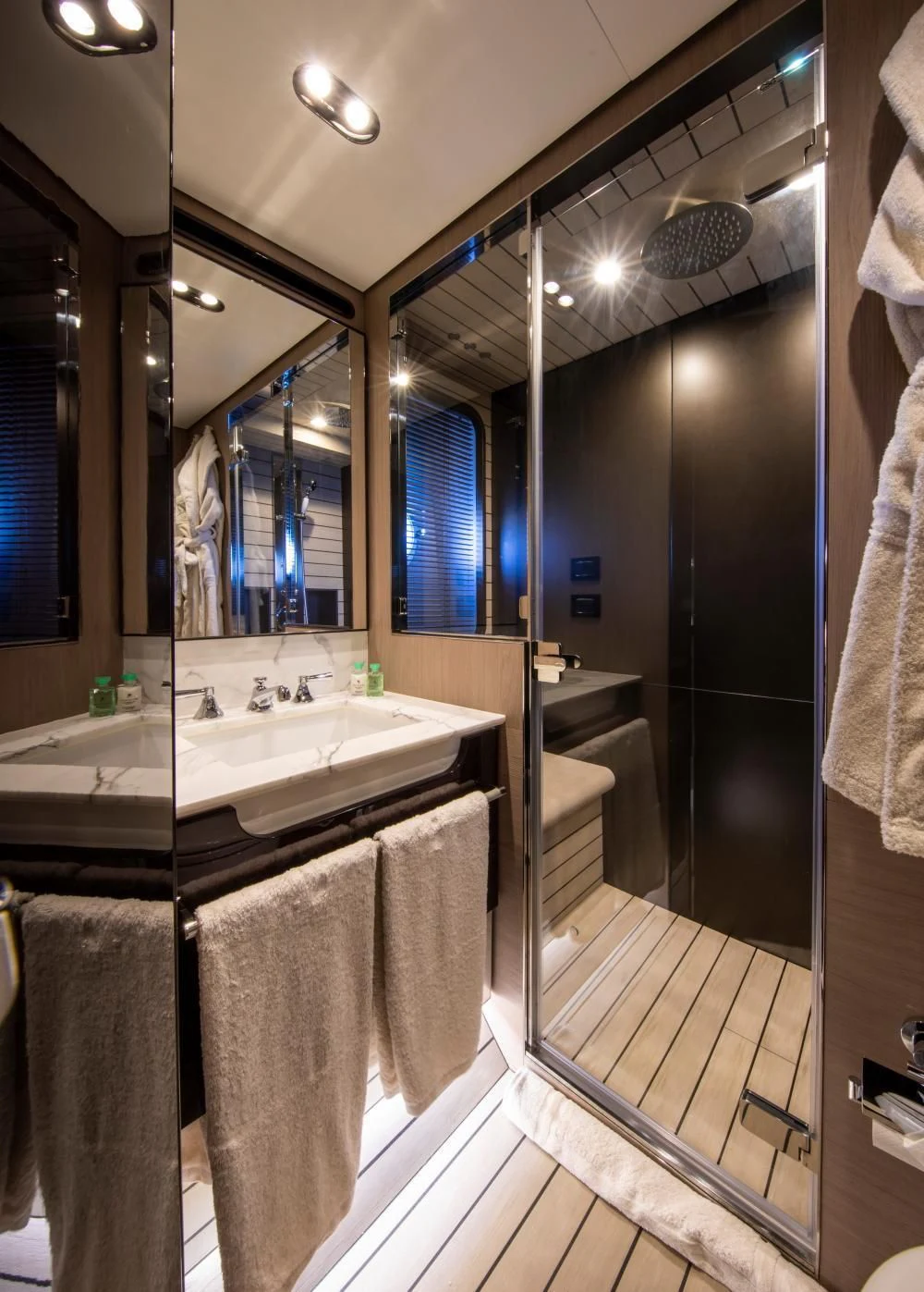 a bathroom with a large mirror aboard CLOUDY BAY Yacht for Sale