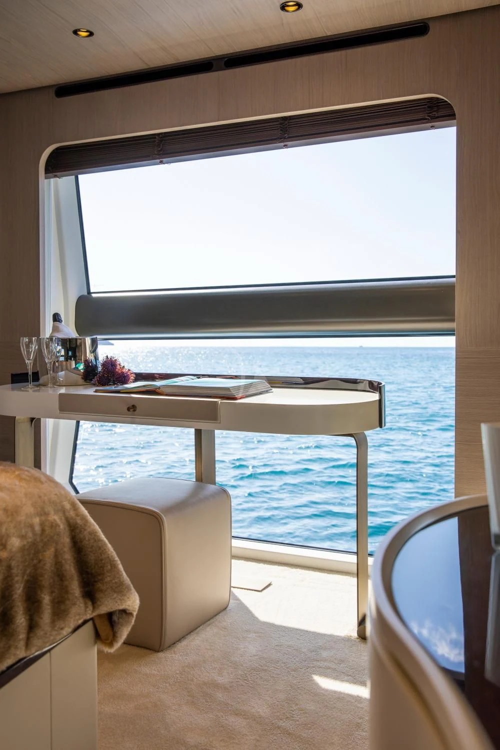a room with a table and chairs aboard CLOUDY BAY Yacht for Sale