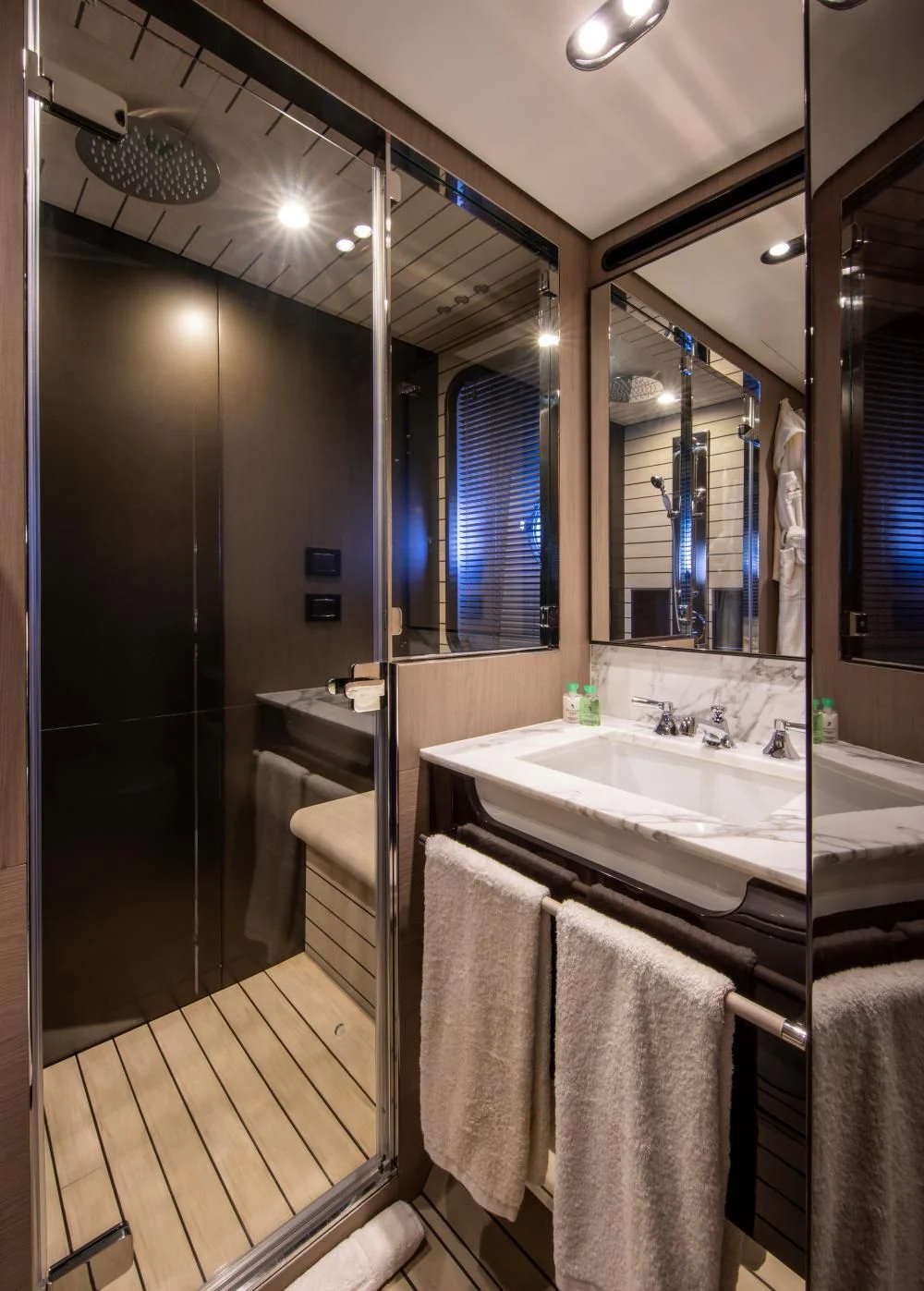 a bathroom with a large mirror aboard CLOUDY BAY Yacht for Sale