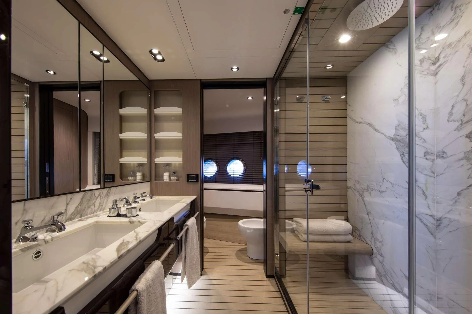 a bathroom with a glass shower aboard CLOUDY BAY Yacht for Sale