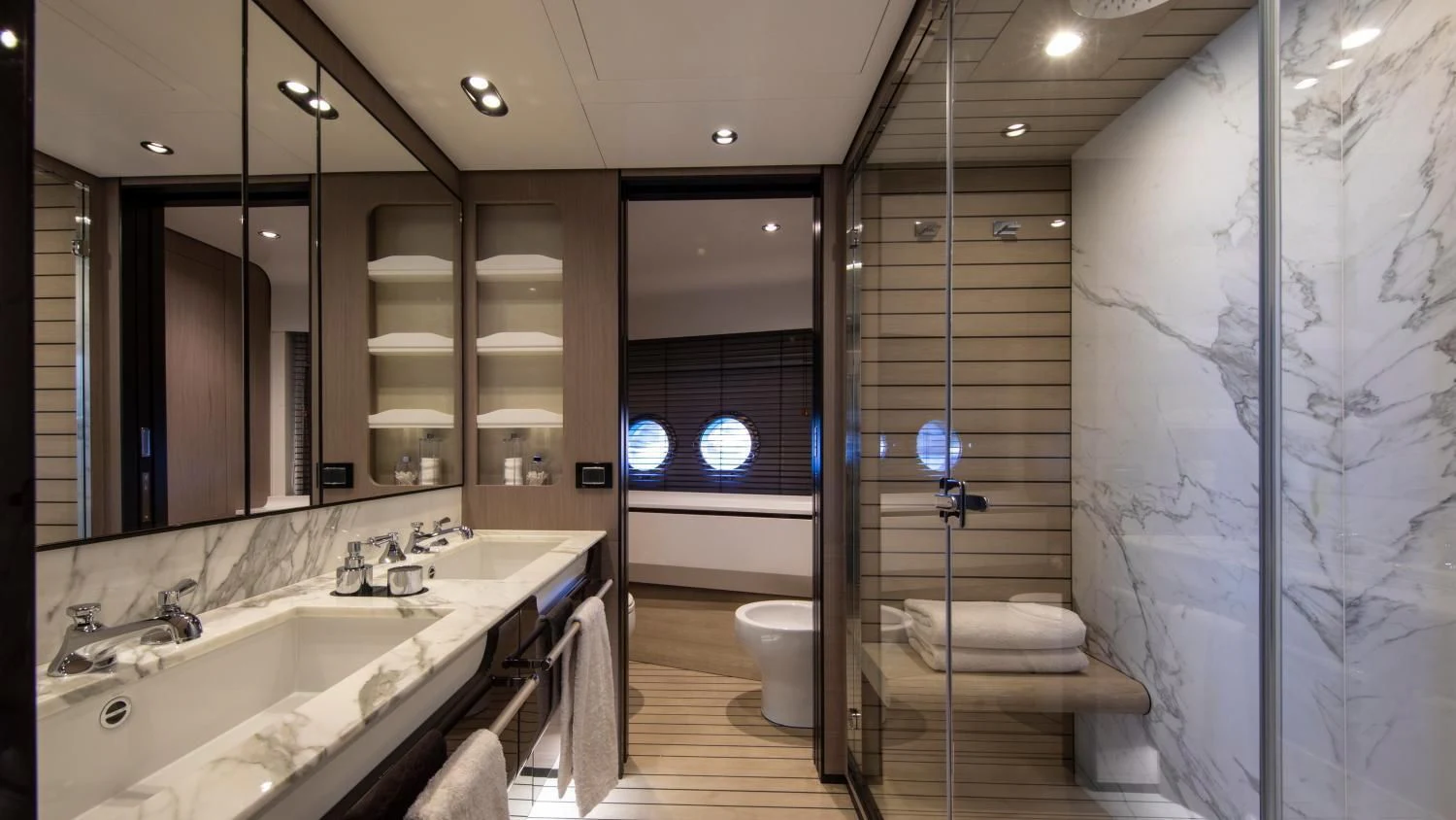 a bathroom with a glass shower aboard CLOUDY BAY Yacht for Sale