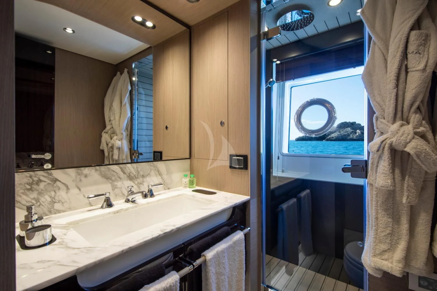 a bathroom with a large mirror aboard CLOUDY BAY Yacht for Sale